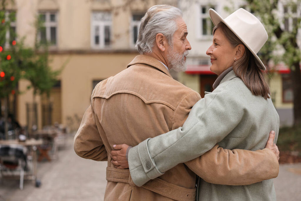 Affectionate senior couple walking outdoors, back view. Space for text - Fotoğraf, Görsel