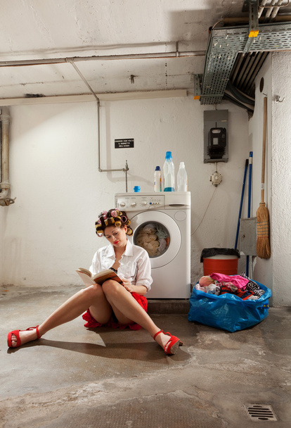 housewife bored in the laundry - Фото, зображення