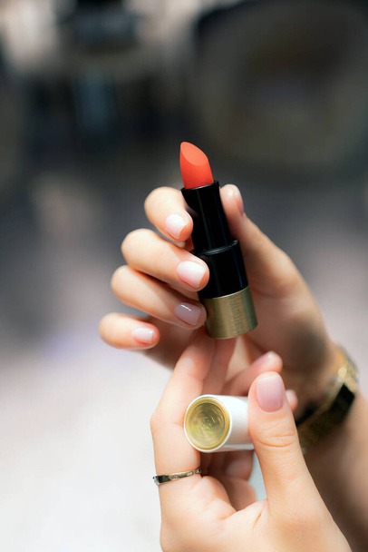 lipstick in a woman's hand - Photo, Image