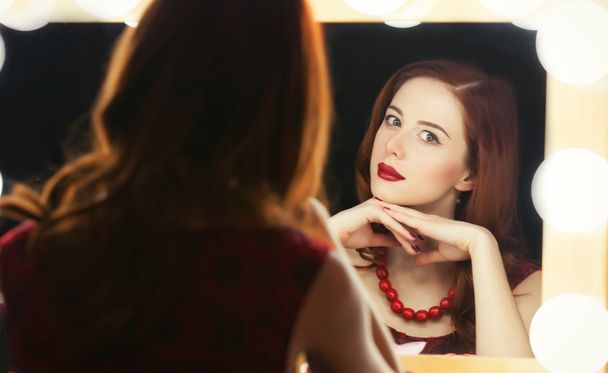 beautiful woman is applying makeup - Photo, Image