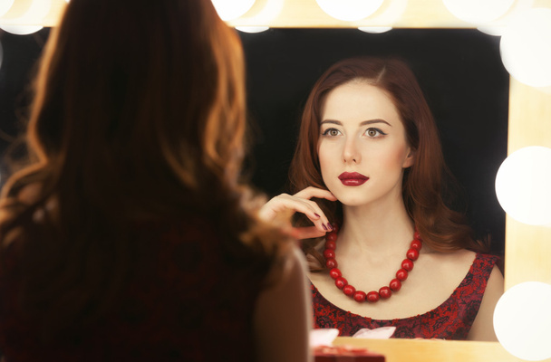 beautiful woman is applying makeup - Foto, Imagem