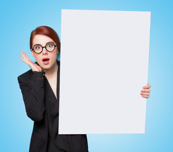 Surprised redhead women with white board  - Photo, Image
