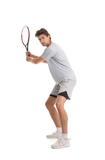 Jeune joueur de tennis avec raquette isolée sur fond blanc - Photo, image