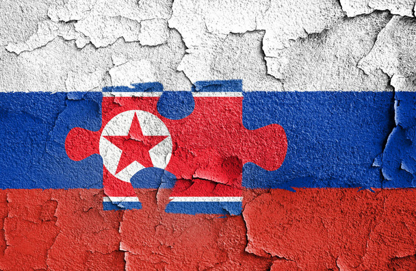 Flag of Russia painted on a wall. Russia and North Korean military collaboration - Photo, Image