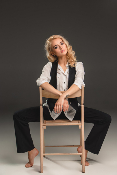 Beauty blond woman on chair - Фото, зображення