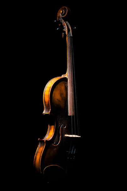 Vintage violin on black background - Fotó, kép