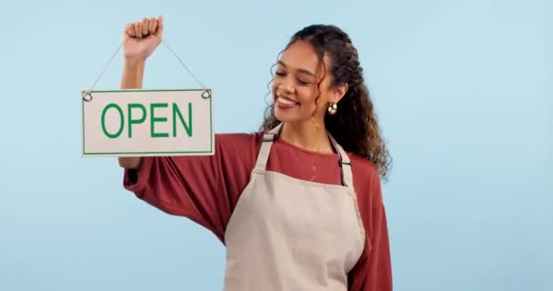 Happy woman, small business and open sign with thumbs up in success against a studio background. Portrait of female person, employee or waitress smile with like emoji, yes sign or ready for service. - Footage, Video