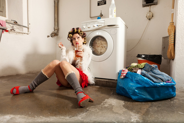 housewife bored in the laundry - Фото, изображение