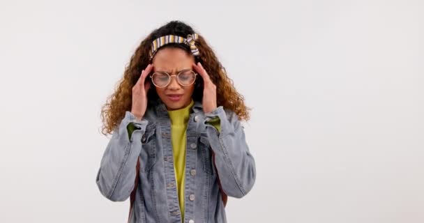 Headache, stress and gen z girl with glasses in studio frustrated by vertigo, brain fog or blurred vision on white background. Eye strain, face and female student with anxiety, mistake or disaster. - Footage, Video