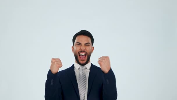 Face, business man and excited for success in studio to celebrate profit, promotion or winning deal on white background. Portrait, happy arab worker or shout with fist in celebration, winner or pride. - Footage, Video