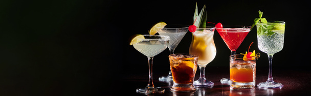 set of zesty cocktails with fresh decorations on black background, concept, banner - Photo, Image