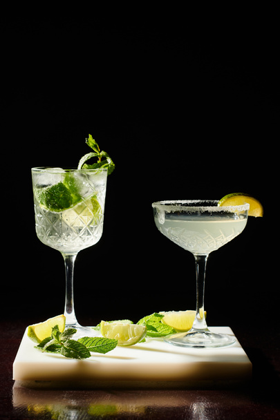 thirst quenching margarita and bohemian rhapsody with lime on black backdrop, concept - Photo, Image