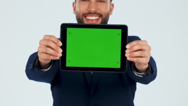 Tablet, presentation and green screen with face of man in studio for logo, social media or deal on white background. Digital, display and portrait of guy model show mockup for brand, web or ux design. - Footage, Video