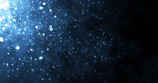 Underwater dust particles moving under rim light tiny source .Particles luxury premium smooth bokeh background.The glittering award show dust, tail wave shining fairy dust. - Photo, Image