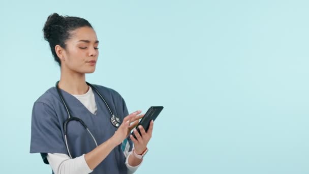 Nurse, woman laugh and phone for healthcare communication, social media meme or funny chat in studio. Student or medical doctor on mobile and telehealth mockup or happy advertising on blue background. - Footage, Video