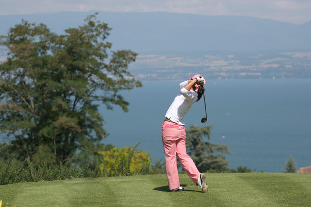 Lady golf swing on a golf course - Photo, Image