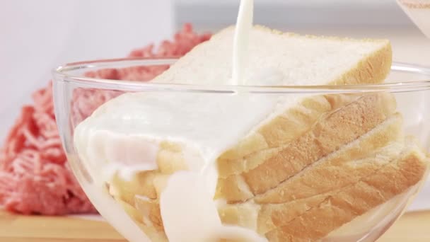 Bread being soaked in milk - Footage, Video