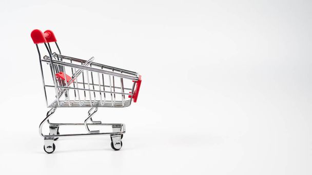 One empty grocery shopping cart isolated over white background - Photo, Image