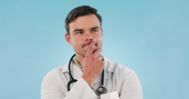 Doctor, man and thinking face in studio for idea, brainstorming or problem solving medical work with hand on mouth. Healthcare, professional and person with doubt, plan or solution mindset for job. - Footage, Video