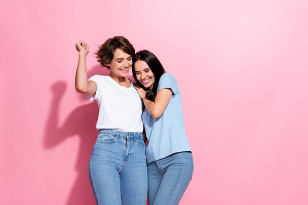 Photo portrait of funny cheerful two young funny girls positive lgbt couple love story cute relatives isolated on pink color background. - Фото, зображення