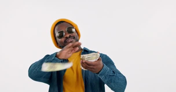 Money rain, rich and man in studio for winning bonus, wealth and hip hop artist deal on white background. Happy african musician, rapper and dance for lotto reward, financial freedom or gambling cash. - Footage, Video