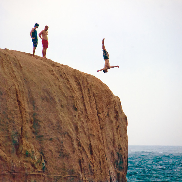 Man jumping from the rock - Foto, Bild
