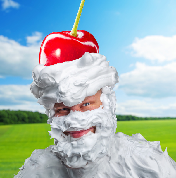 Smiling man with whipped cream and a cherry - Photo, Image