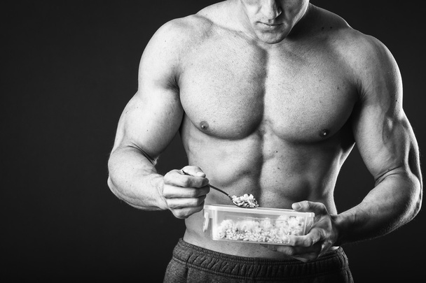 Bodybuilder eating sport food - Fotografie, Obrázek