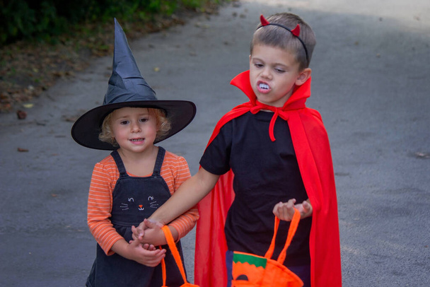 Children dressed in costumes for Halloween, festive night. Selective focus. Halloween - Photo, Image