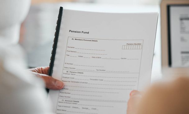 Person, hands and documents for pension fund, application or paperwork in retirement at home. Closeup of elderly or retired form, contract or plan for old age allowance, funding or insurance in house. - Photo, Image