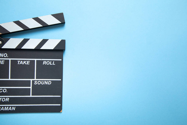 Movie clapper on the blue background. - Photo, Image