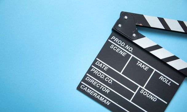 Movie clapper on the blue background. - Photo, Image