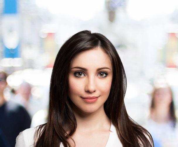 Woman walking in a crowded street - Photo, Image