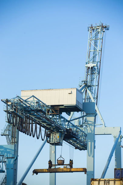Shore crane loading containers in freight ship - Photo, Image