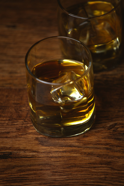 shot of whiskey on old wooden surface - Foto, immagini