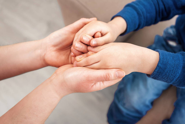 Love, support and mother holding hands with child for trust, safety and hope for foster care or adoption.Family connect in hope, advice and peace while bonding - Foto, imagen