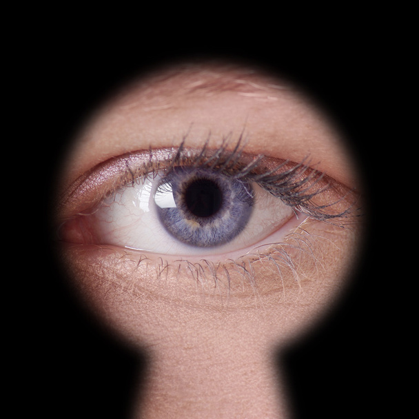 eye looking through keyhole - Photo, Image