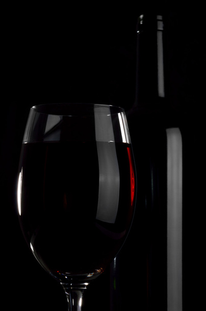Bottle and wineglass. - Foto, imagen