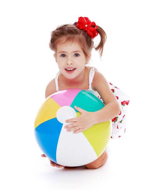 Caucasian beautiful little girl holding a ball - Valokuva, kuva