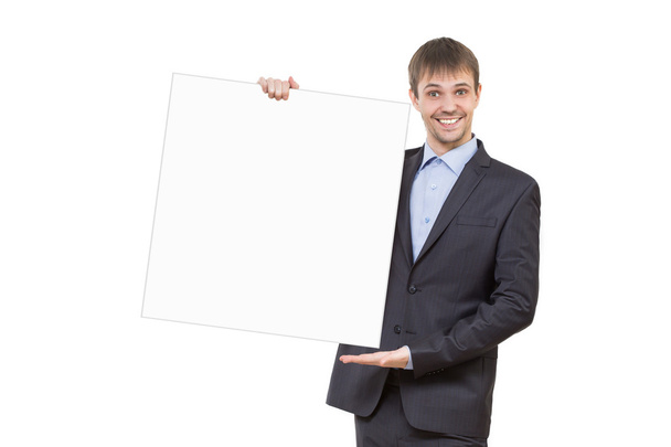 smiling business man showing blank signboard - Фото, зображення