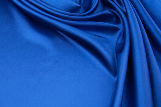Синя атласна або шовкова тканина як фон
 - Фото, зображення