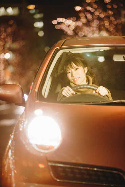 beautiful asian woman driving car in city - Photo, image