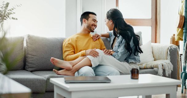 Couple, happy and talking on home sofa with a smile, security and love in healthy relationship. Young man and woman together in living room for affection, forehead touch and communication with care. - Fotografie, Obrázek