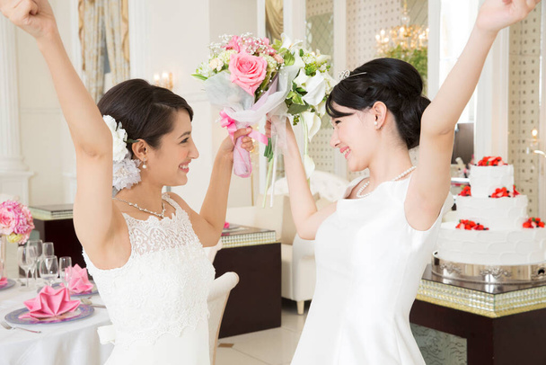 two beautiful asian brides  - Фото, изображение
