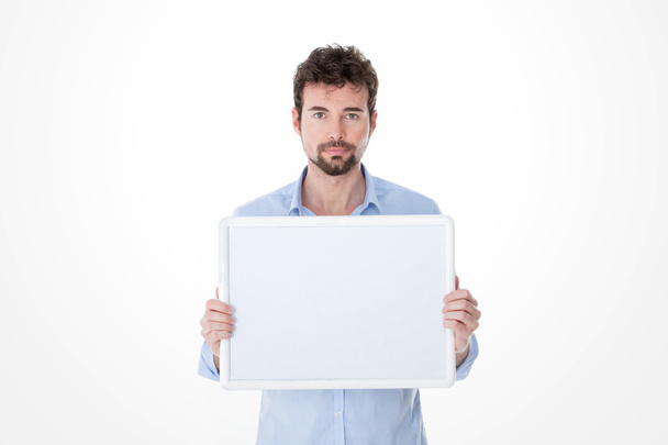 man with goatee holding an empty board - Foto, afbeelding