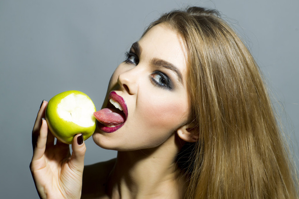 Glamour girl with an apple - Photo, Image