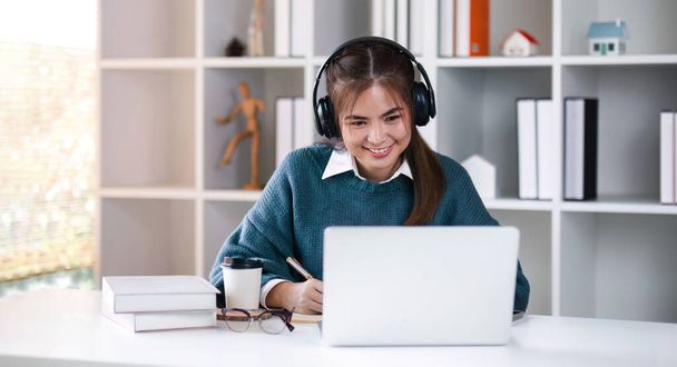 Asian girl student online learning class study online video call zoom teacher, Happy asian girl learn english language online with computer laptop. - Фото, изображение