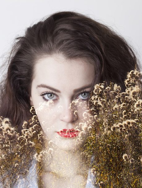 Double exposure of girl with gorgeous eyes and mountain flowers - Valokuva, kuva