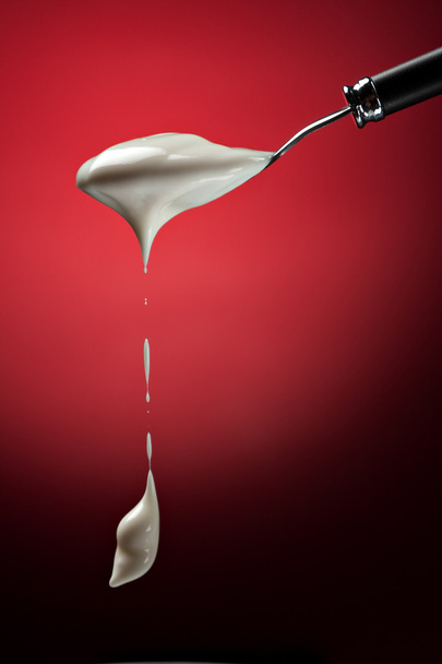 Spoon with healthy yogurt - Foto, afbeelding