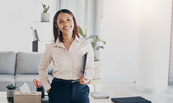 Happy, smile and portrait of businesswoman in the office with positive, good and confident attitude. Happiness, creative career and young female designer from Colombia standing in modern workplace - Photo, Image